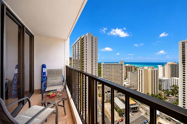 Bask in breathtaking views of the city skyline and the sparkling ocean from your expansive private lanai, complete with seating for ultimate relaxation.