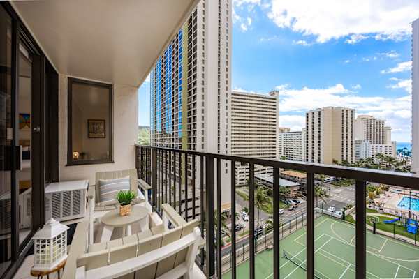 Soak in stunning cityscapes, tennis court views, and fresh island air from your private, fully furnished covered balcony.   