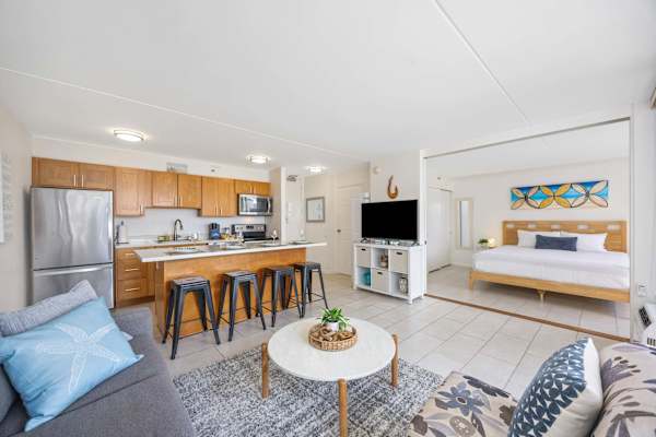 Your condo has a living area with a smart TV, a fully equipped kitchen, a dining area for 4, and a sliding door that separates the living area and the bedroom.