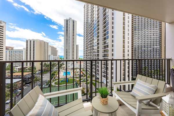 Step onto your private balcony and take in city skyline views and comfortable outdoor seating.