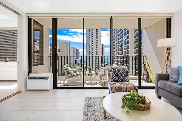 Soak in the island breeze through floor-to-ceiling glass sliding doors that open seamlessly from the living room to a private, view-filled balcony.