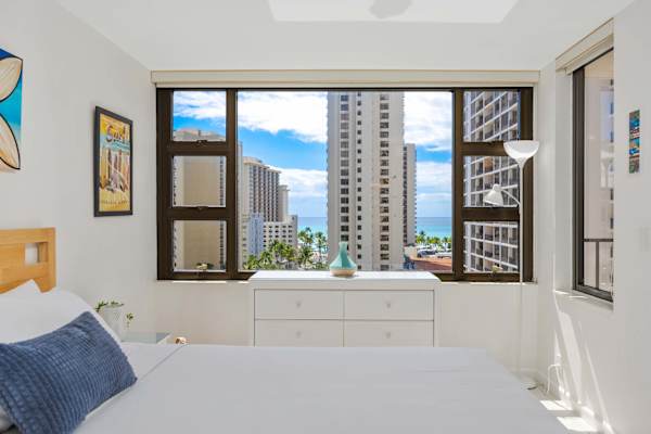 Wake up to stunning city skylines and sparkling partial ocean views from your bedroom, designed for your ultimate tropical relaxation.
