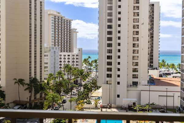 Take in picturesque views of vibrant city towers, lush palm trees, and the partial sparkling turquoise ocean right from your balcony.   