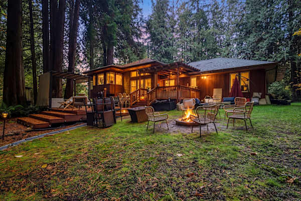 Woodinville Retreat | Decks | BBQ & Fireplace 55 Unwind outdoors and take in the quiet beauty of the property, beautifully lit as evening settles in.