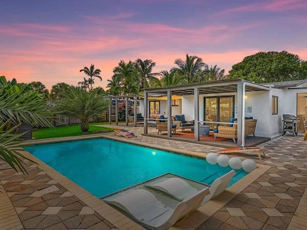Heated saltwater pool at a Chādy-managed Wilton Manors luxury vacation rental, Fort Lauderdale area