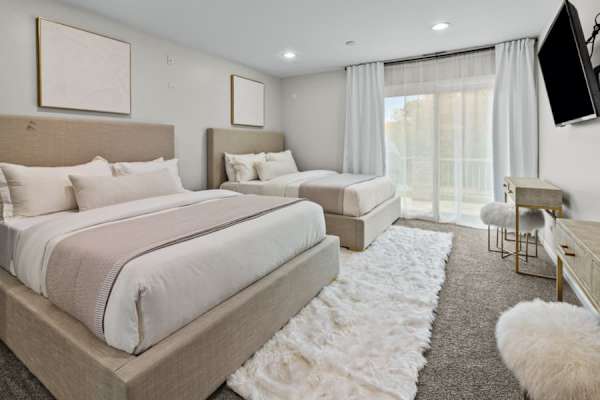 Retreat to the comfort of Bedroom #2, where two queen beds await to provide a restful haven for family or friends.