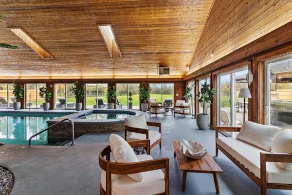 Relaxation redefined: soothe your senses in our large hot tub, letting the gentle jets massage away the day's excitement.