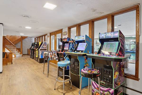 Flashback to the golden era of gaming in this lively arcade area, where classic games and neon lights ignite endless entertainment.