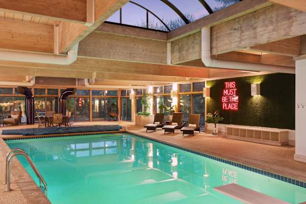 Year round warmth and crystal clear waters await in this serene indoor pool, set against the backdrop of lush golf course views.