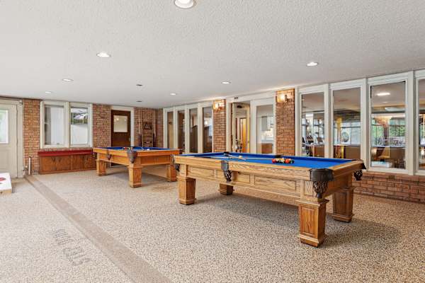 Rack 'em up in the poolside game room, where the play of billiards complements the joy of swimming, all within a setting of relaxed luxury.