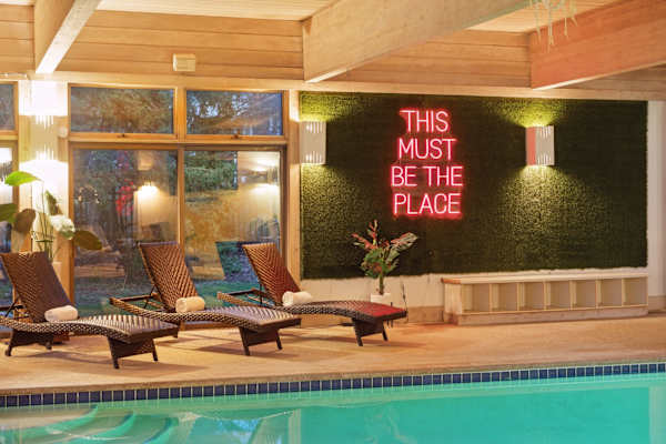 Year round warmth and crystal clear waters await in this serene indoor pool, set against the backdrop of lush golf course views.