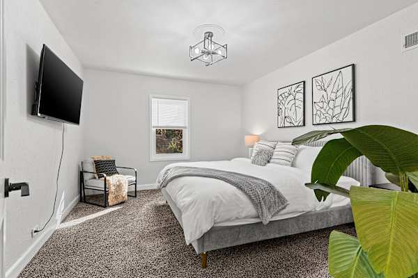 Bedroom #3: A queen-sized sanctuary designed for deep relaxation and sweet dreams, with a touch of contemporary charm.