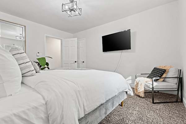 Bedroom #3: A queen-sized sanctuary designed for deep relaxation and sweet dreams, with a touch of contemporary charm.