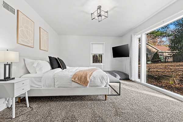 Bedroom #2: Serenity meets comfort in this king-sized chamber, offering a peaceful retreat from the day's adventures.