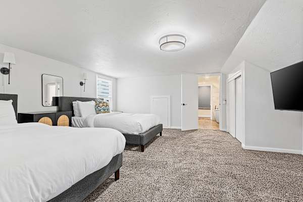 Bedroom #4: A dual-queen arrangement with ensuite, designed for shared comfort and ease.