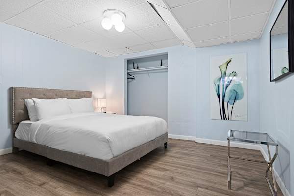 Discover the peaceful charm of Bedroom #6, a lower level retreat with a queen bed, offering guests a serene escape.