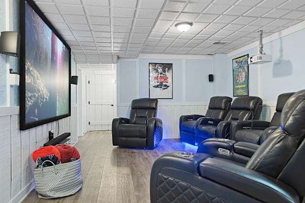 Lower level theatre area with projector, 100" screen and newly installed Klipsche surround sound.  