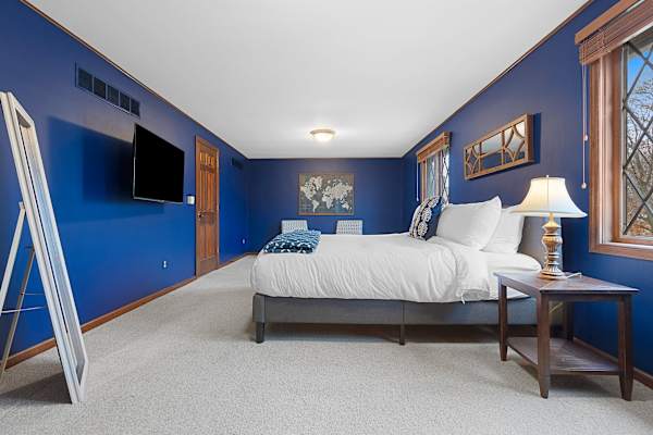Bedroom #1 offers a restorative sleep experience with its king bed, set in a room that balances tranquility and chic comfort.