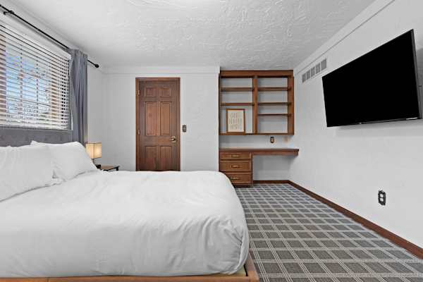 Bedroom #4: A serene space with a comfortable queen bed, offering a restful haven for guests to unwind after a day's adventures.