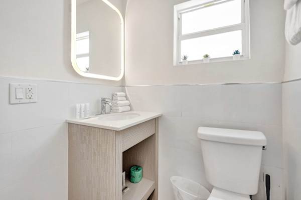 Compact vanity bathroom with LED mirror