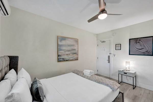 Bright king bedroom with ceiling fan
