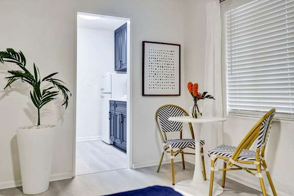 Cozy dining nook with bistro chairs and artwork