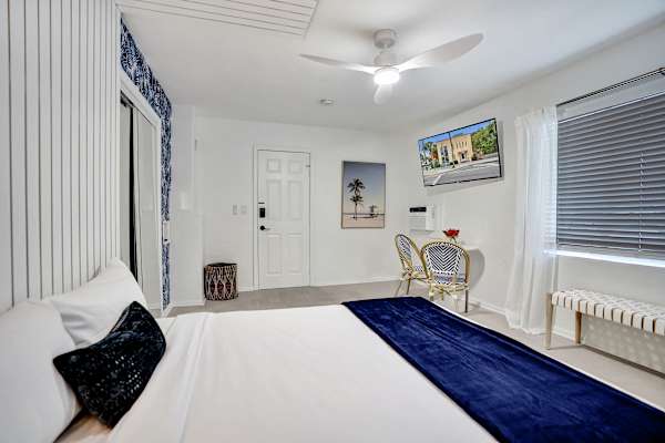Studio from bed angle showing entry and sitting corner