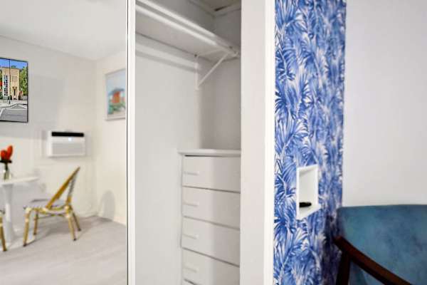 Open closet with built-in drawers and hanging space