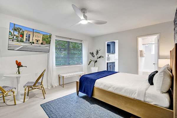 Bright king bedroom with coastal décor and seating