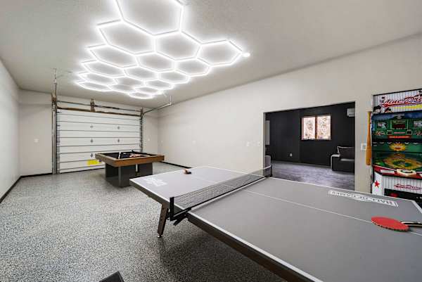 Table tennis and billiards located in entertainment complex 100 feet from home.  
