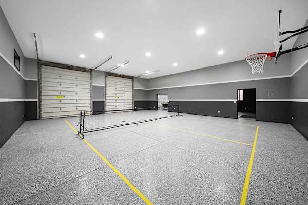 Indoor basketball and mini pickleball court in private entertainment complex