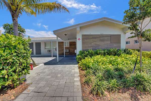 Property street-front exterior with landscaping