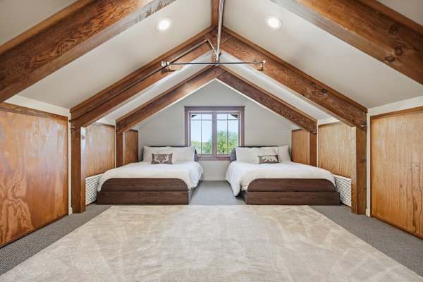 Upper loft area features two full beds.  