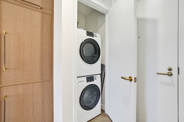 In-unit stacked washer and dryer