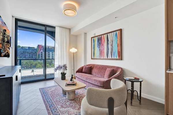 Sunlit living room with balcony and designer sofa