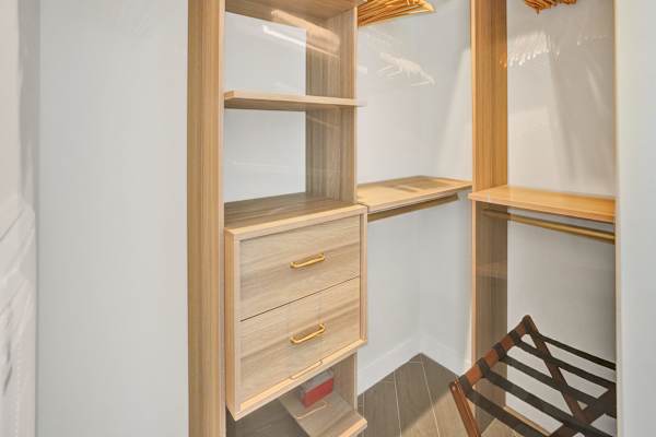 Walk-in closet with built-in drawers and shelving