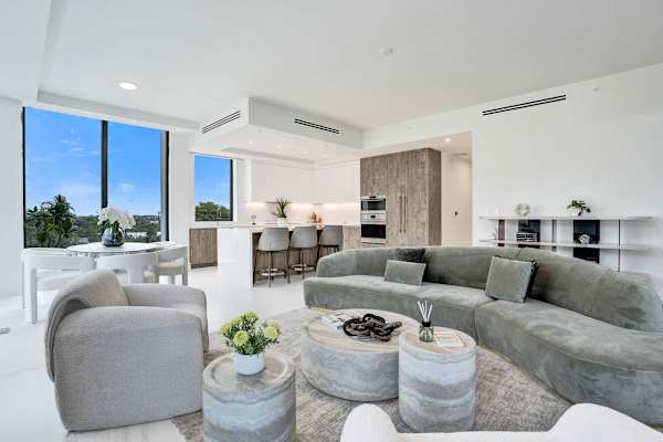 Open-plan living room flowing to kitchen