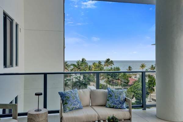 Balcony with sweeping ocean and palm view