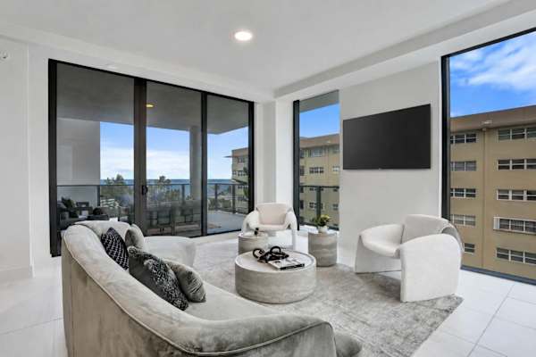 Living room with panoramic windows and TV