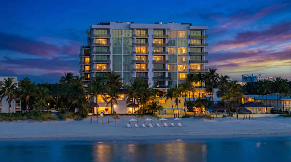 Beachfront building at sunset from the shore