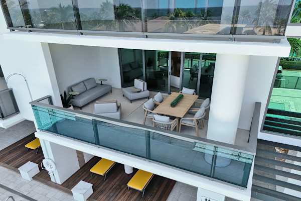 Spacious balcony with outdoor dining and lounge seating