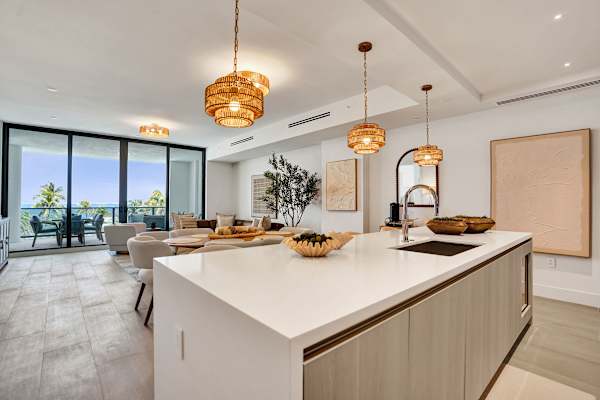 Kitchen island open to bright living area