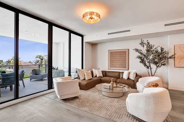 Bright living room opening to private balcony