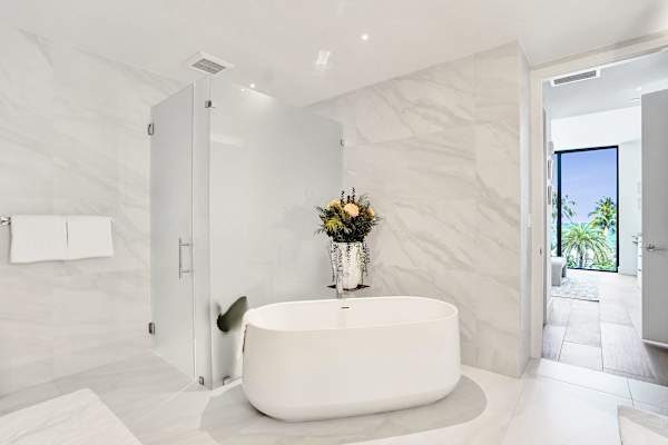 Marble bathroom with soaking tub and shower