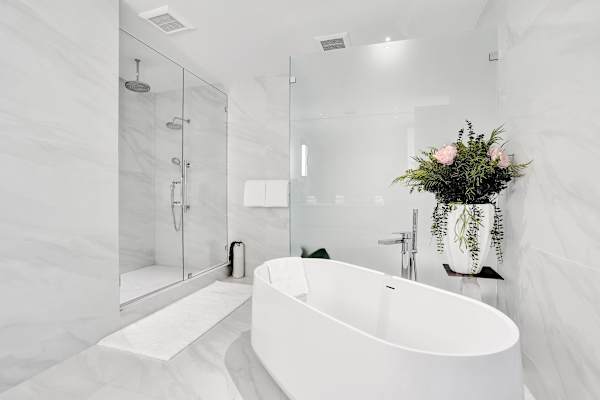 All-marble bathroom with tub and rain shower