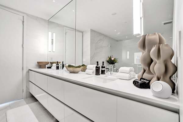 Double vanity bathroom with large mirror