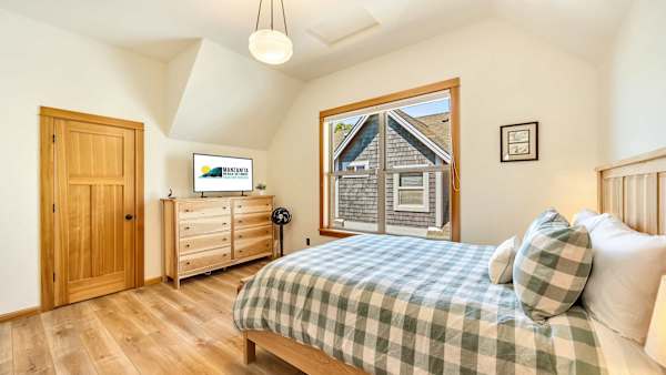 Comfortable queen bedrooms provide a restful retreat after coastal adventures.
