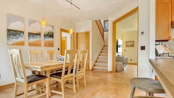 Gather around the dining table for meals, conversations, and vacation memories.