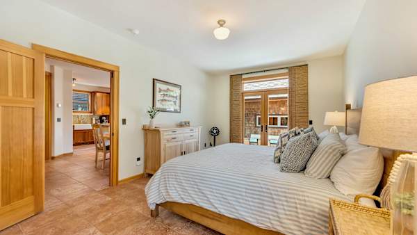 The spacious primary suite offers a relaxing retreat on the main level.