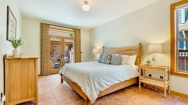 Rest easy in the comfortable king-size bed after a day at the beach.
